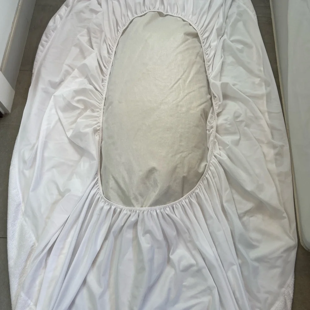 White twin waterproof mattress cover - to protect twin sized mattress. Like new